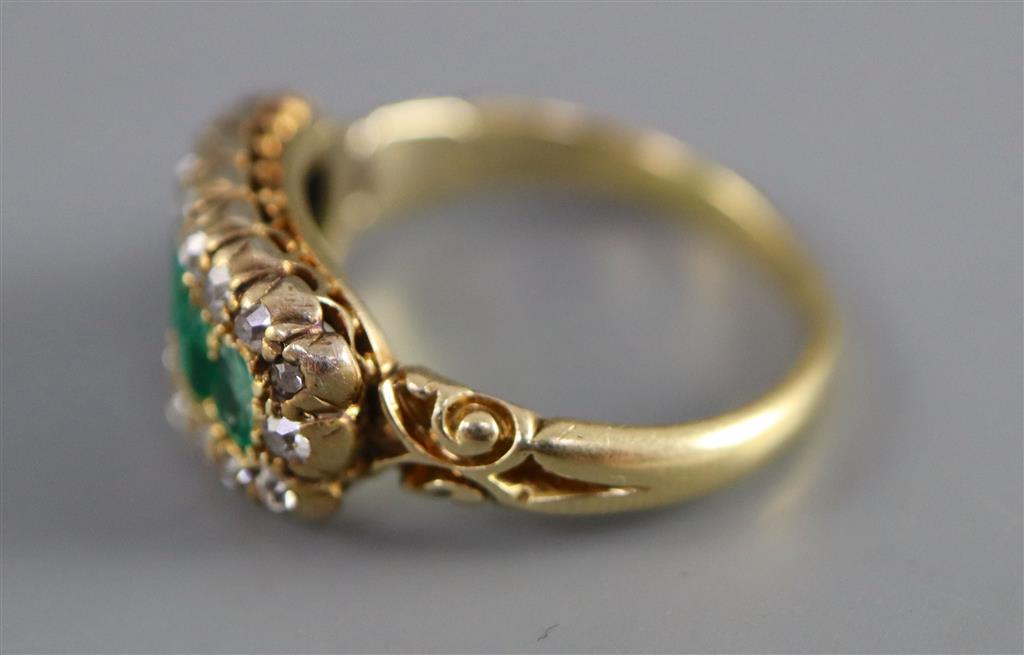 A late Victorian gold, graduated five stone emerald and diamond cluster half hoop ring,
